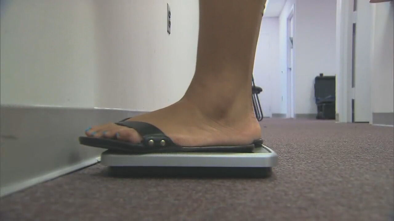 woman standing on scales